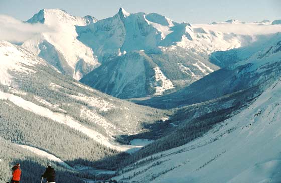 Two skiers eye the sawmill site